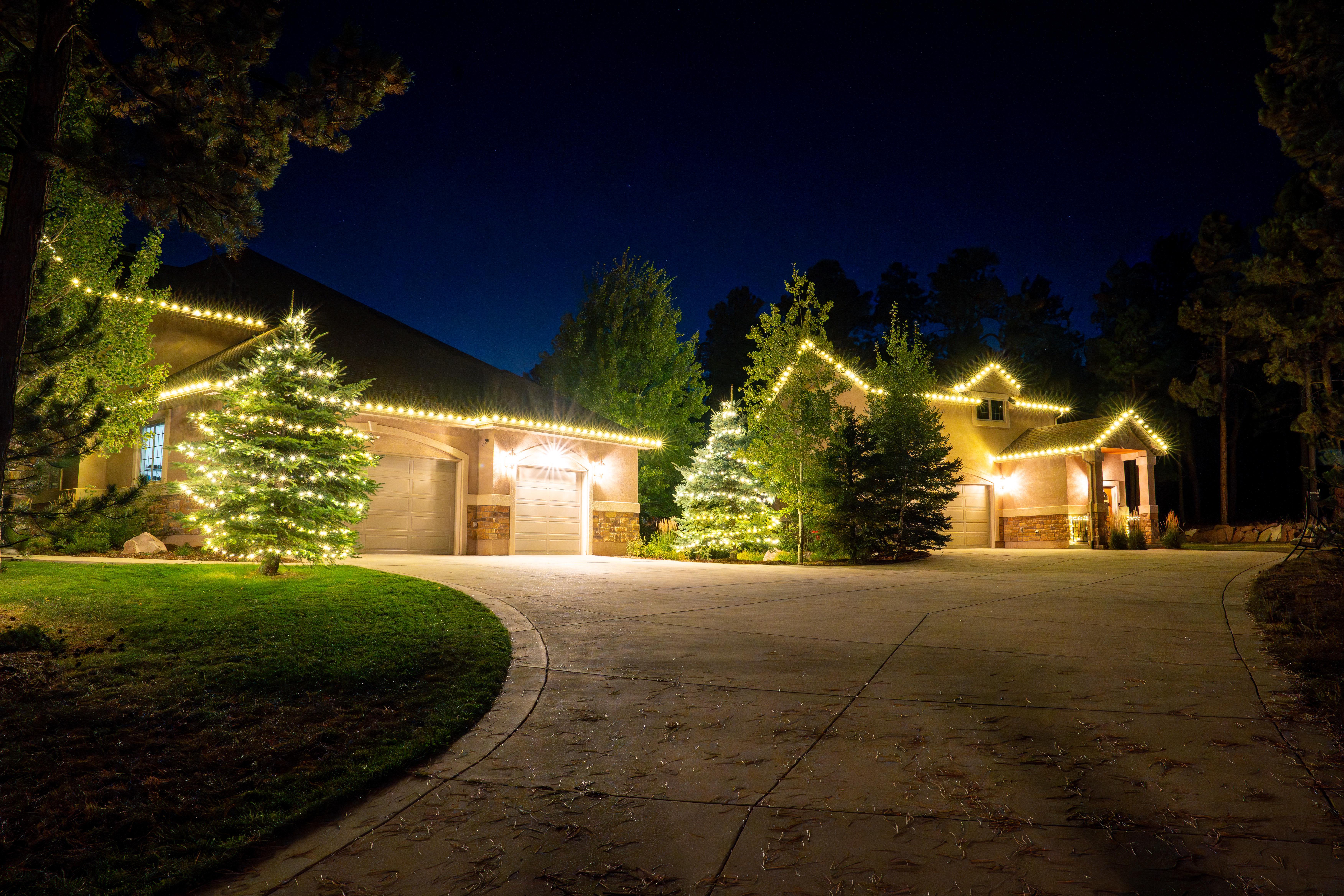 Warm white lights illuminating a home exterior